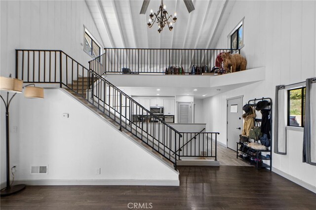 26429 Apache Trl, Rimforest, CA 92378 - staircase with high vaulted ceiling, wood finished floors, and a chandelier