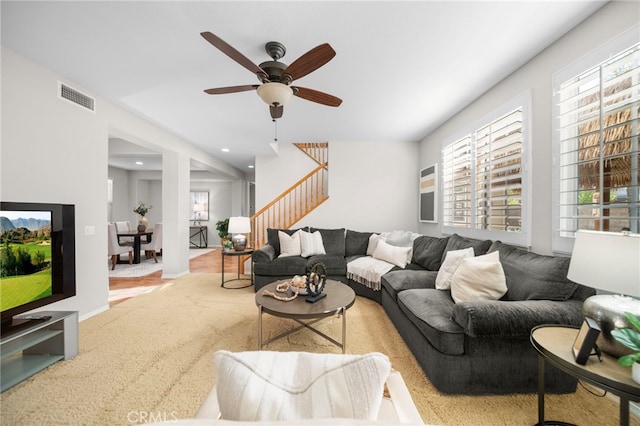 living room with visible vents, ceiling fan, stairway, and recessed lighting
