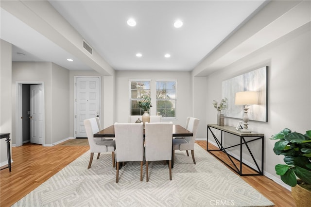 dining area featuring visible vents, recessed lighting, light wood-style flooring, and baseboards