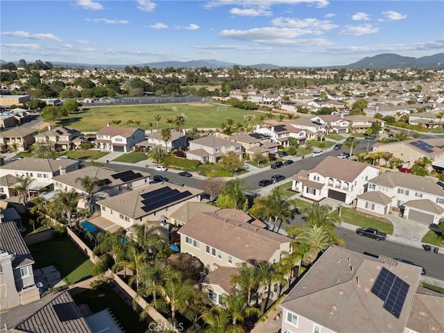 birds eye view of property with a mountain view and a residential view