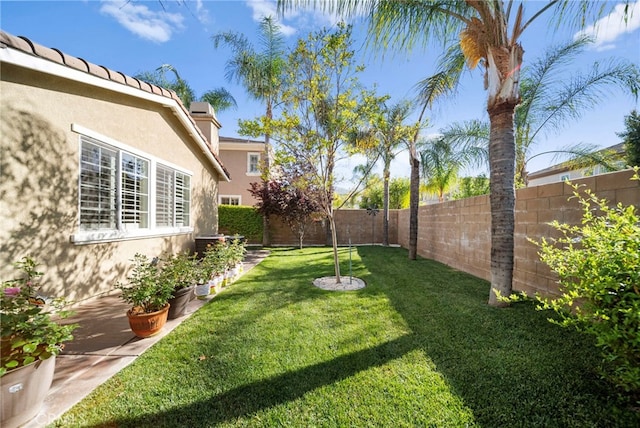 view of yard with a fenced backyard