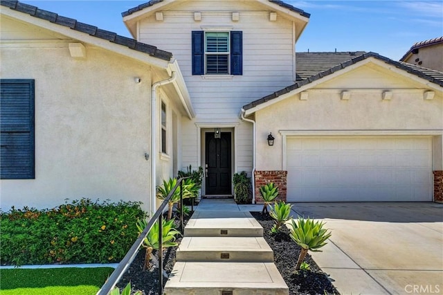 11927 Bunting Cir, Corona, CA 92883 - traditional home with an attached garage, concrete driveway, brick siding, and stucco siding