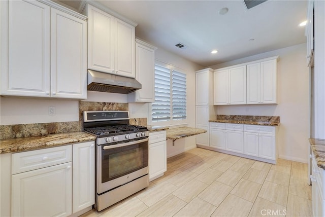11927 Bunting Cir, Corona, CA 92883 - kitchen with gas stove, under cabinet range hood, white cabinetry, and recessed lighting