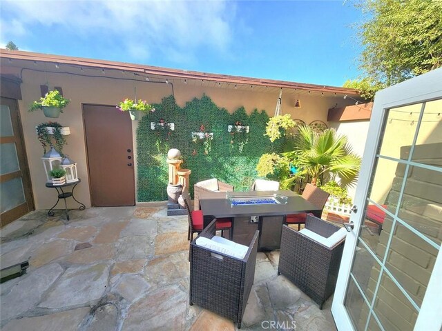view of patio featuring outdoor dining space