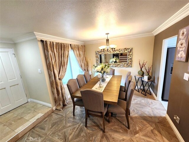 dining room with baseboards, ornamental molding, a textured ceiling, and an inviting chandelier