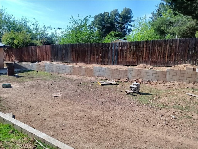 12055 Douglas St, Yucaipa, CA 92399 - view of yard with a fenced backyard