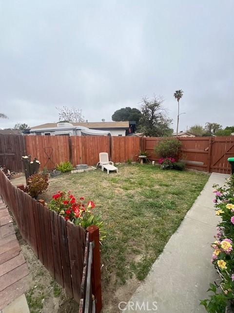 view of yard with a fenced backyard