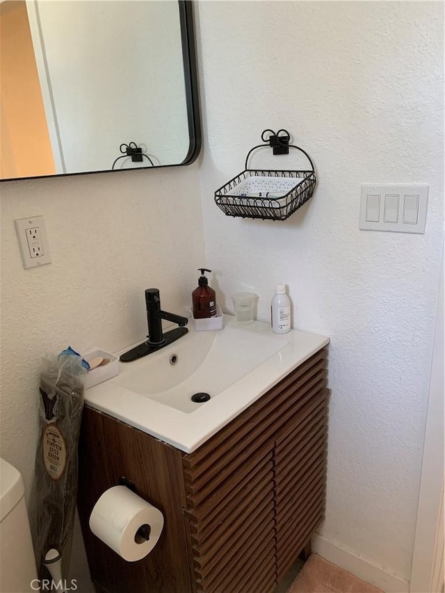 half bath with toilet and vanity