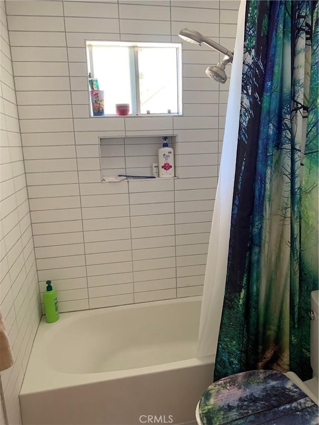 full bathroom with shower / tub combo