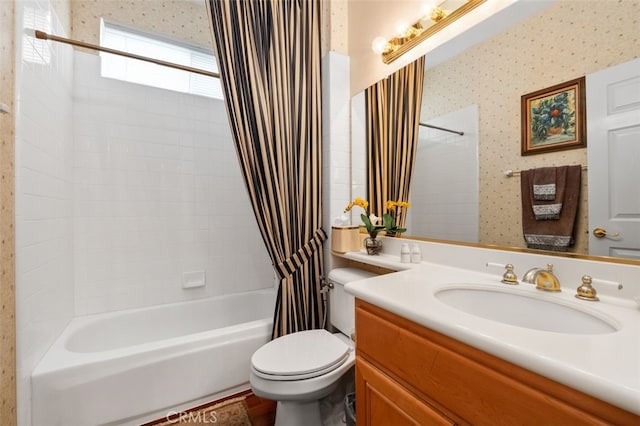 bathroom with shower / tub combo, vanity, and toilet