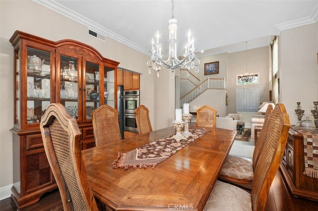 dining area featuring stairway, visible vents, crown molding, and a notable chandelier