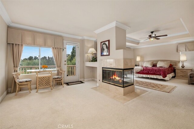 carpeted bedroom featuring a fireplace, ornamental molding, access to exterior, and baseboards