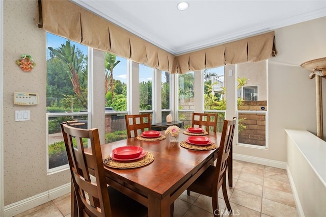 sunroom featuring tile patterned floors, crown molding, recessed lighting, and baseboards
