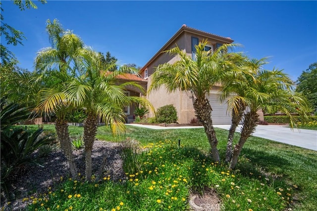 32851 Naples Ct, Temecula, CA 92592 - view of front facade featuring a garage, stucco siding, a tile roof, and concrete driveway