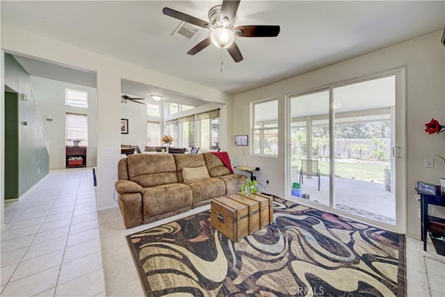 32851 Naples Ct, Temecula, CA 92592 - living room with light tile patterned flooring, ceiling fan, and visible vents