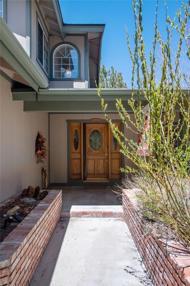 doorway to property featuring a porch