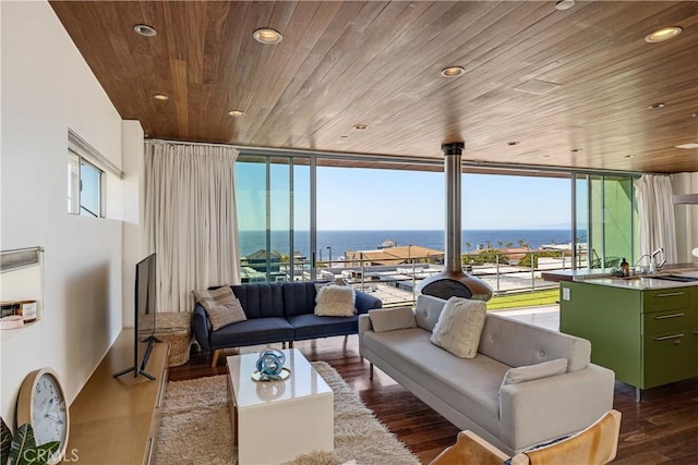 living room featuring wood ceiling, dark wood-type flooring, recessed lighting, and floor to ceiling windows