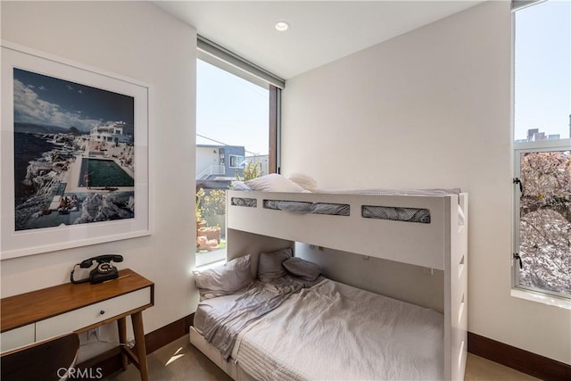 bedroom with baseboards and recessed lighting