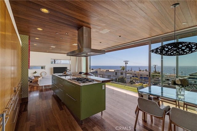 kitchen featuring dark wood finished floors, wooden ceiling, stainless steel gas stovetop, green cabinets, and island exhaust hood