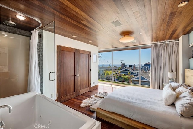 bedroom with access to exterior, a wall of windows, wood finished floors, and wood ceiling