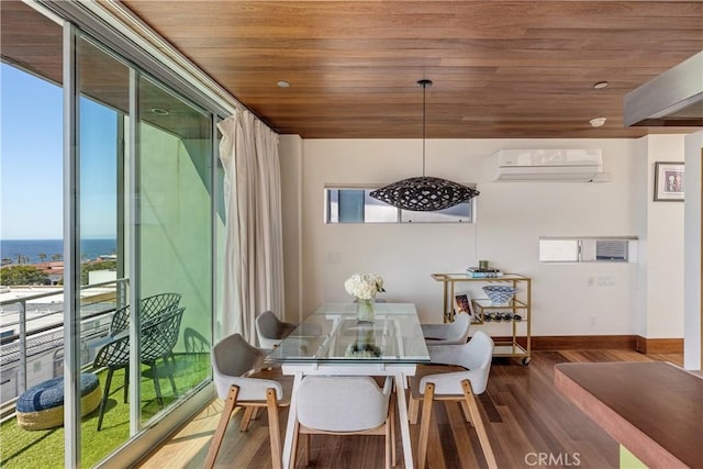 dining room featuring an AC wall unit, baseboards, wood finished floors, and wood ceiling