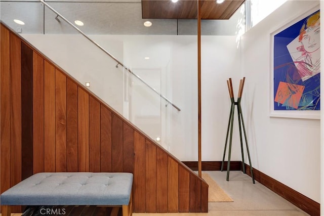stairs featuring baseboards and recessed lighting