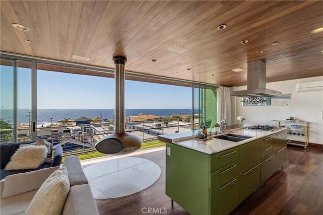 kitchen with wood ceiling, floor to ceiling windows, green cabinetry, and a sink