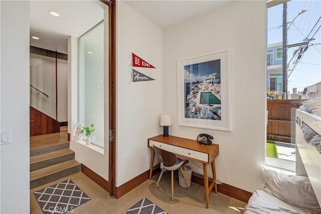 hallway featuring baseboards