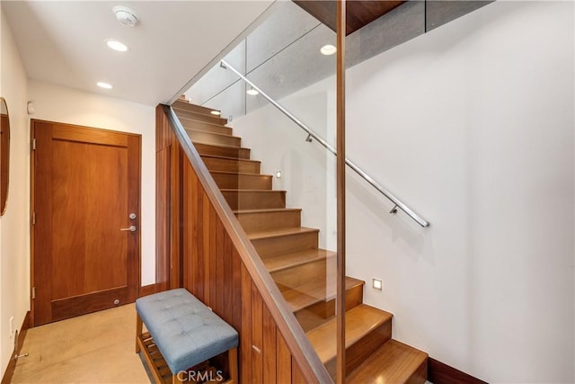staircase featuring recessed lighting and carpet