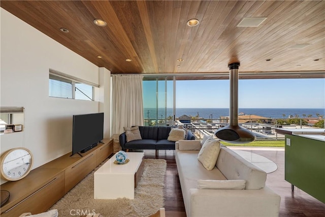 living area featuring recessed lighting, wooden ceiling, expansive windows, and wood finished floors