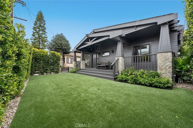 1012 10th St, Manhattan Beach, CA 90266 - back of house featuring a lawn and covered porch