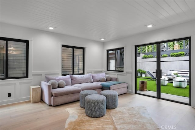 1012 10th St, Manhattan Beach, CA 90266 - living room with recessed lighting, wainscoting, light wood-style flooring, and a decorative wall