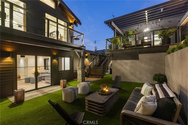 1012 10th St, Manhattan Beach, CA 90266 - view of yard with an outdoor living space with a fire pit, a pergola, stairway, and a balcony