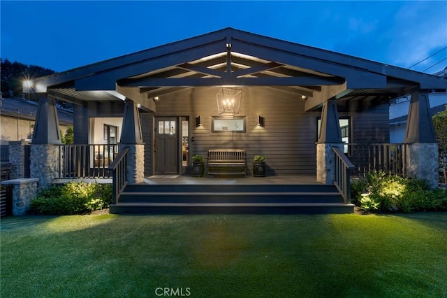 1012 10th St, Manhattan Beach, CA 90266 - rear view of property featuring covered porch and a yard