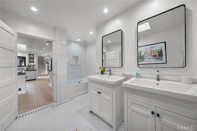 1012 10th St, Manhattan Beach, CA 90266 - full bath with a sink, shower / bathtub combination, recessed lighting, and two vanities