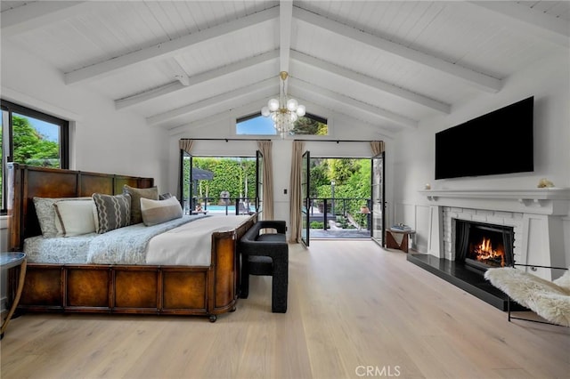 1012 10th St, Manhattan Beach, CA 90266 - bedroom featuring vaulted ceiling with beams, access to outside, multiple windows, and light wood finished floors