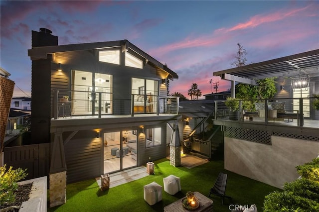 1012 10th St, Manhattan Beach, CA 90266 - back of house featuring a pergola, a balcony, a yard, and a chimney