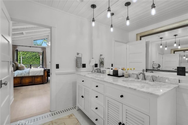 1012 10th St, Manhattan Beach, CA 90266 - bathroom featuring double vanity, ensuite bathroom, a wainscoted wall, wooden ceiling, and a sink