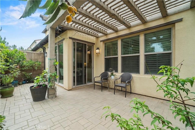 view of patio with fence and a pergola