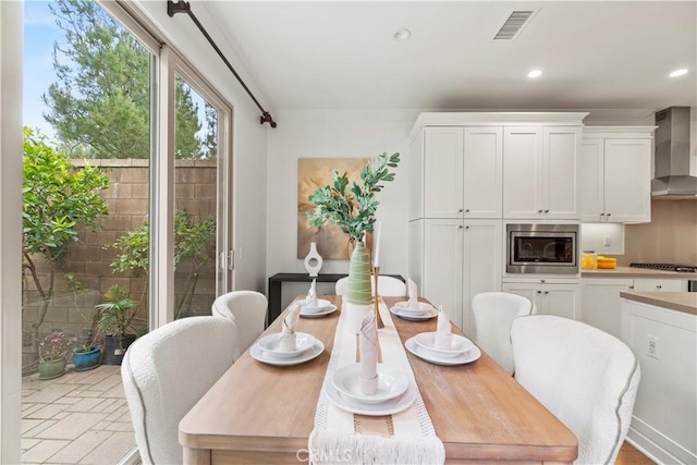 dining area featuring visible vents and recessed lighting