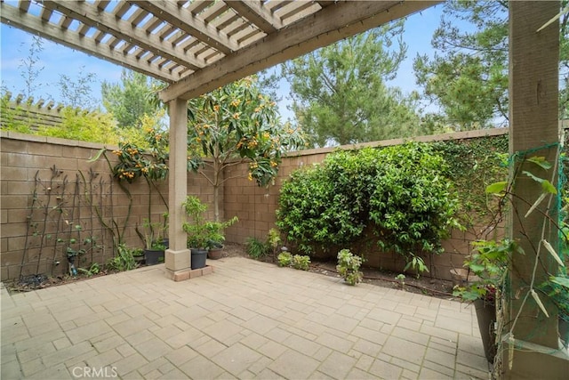 view of patio / terrace with a pergola and a fenced backyard