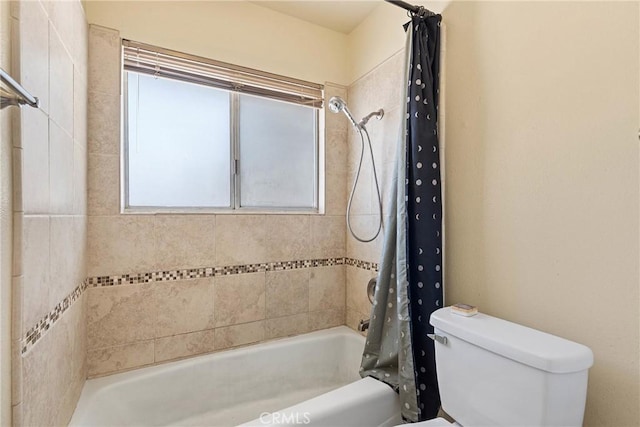 full bathroom featuring shower / tub combo with curtain and toilet