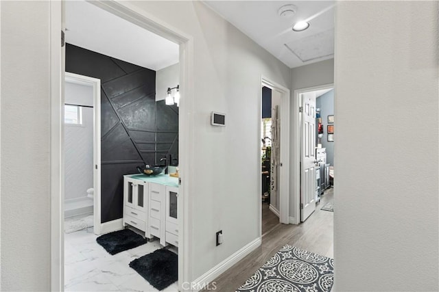 13656 Dronfield Ave, Sylmar, CA 91342 - corridor featuring baseboards and a sink