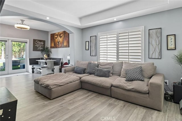 13656 Dronfield Ave, Sylmar, CA 91342 - living area featuring french doors, arched walkways, wood finished floors, and recessed lighting