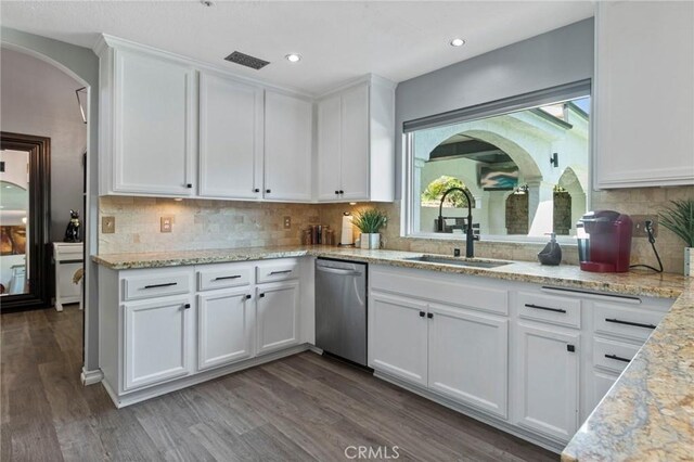 13656 Dronfield Ave, Sylmar, CA 91342 - kitchen featuring a sink, arched walkways, white cabinetry, and dishwasher