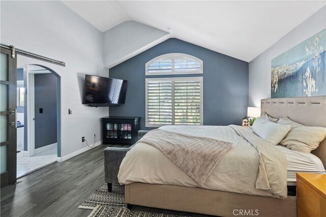 13656 Dronfield Ave, Sylmar, CA 91342 - bedroom with arched walkways, baseboards, wood finished floors, and lofted ceiling