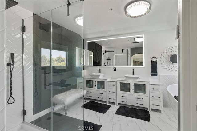 13656 Dronfield Ave, Sylmar, CA 91342 - bathroom featuring vanity, a bathing tub, a shower stall, and marble finish floor