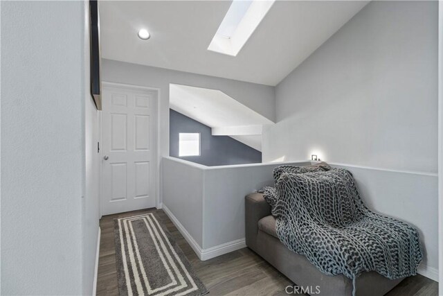 13656 Dronfield Ave, Sylmar, CA 91342 - living area featuring a skylight, baseboards, and wood finished floors