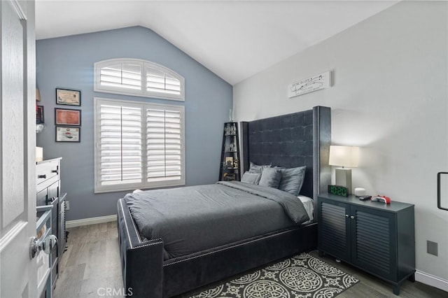 13656 Dronfield Ave, Sylmar, CA 91342 - bedroom featuring baseboards, multiple windows, wood finished floors, and lofted ceiling