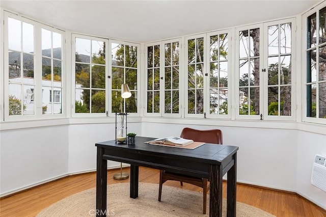 office with wood finished floors and a mountain view